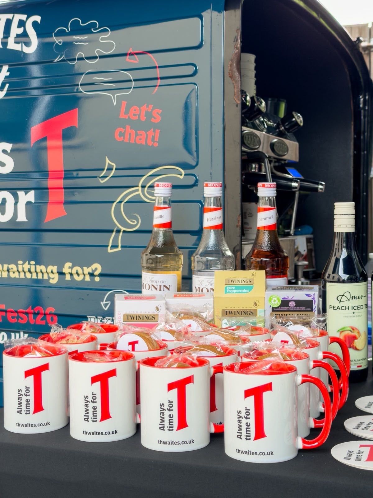 Tea truck van with Thwaites Fest mugs and coffee syrups